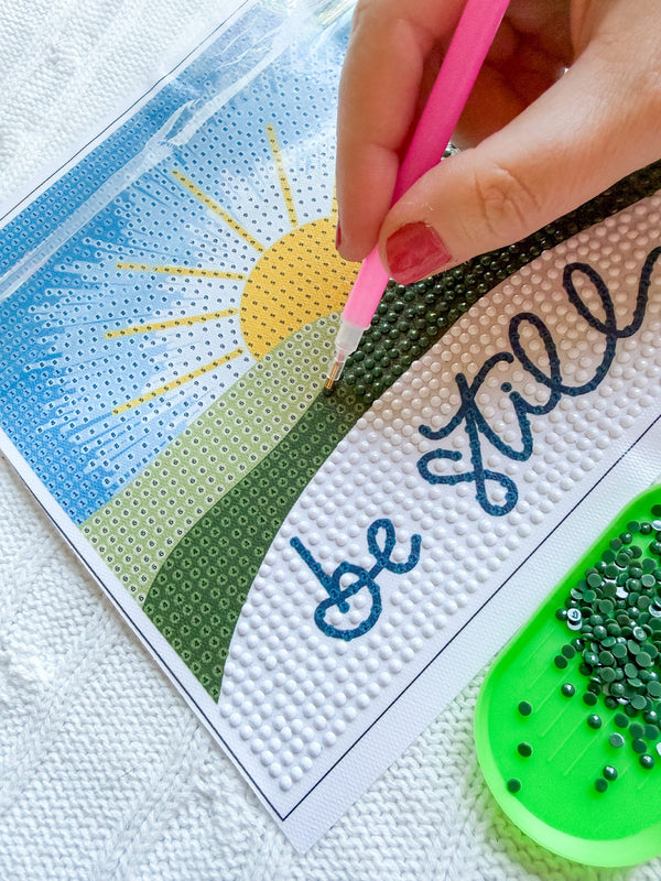 Placing diamonds on a diamond art canvas