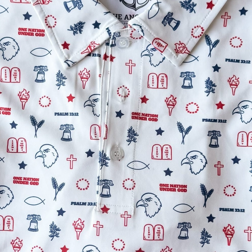 Close-up of the One Nation Under God polo fabric showing Psalm 33:12, eagles and Liberty Bells in the print